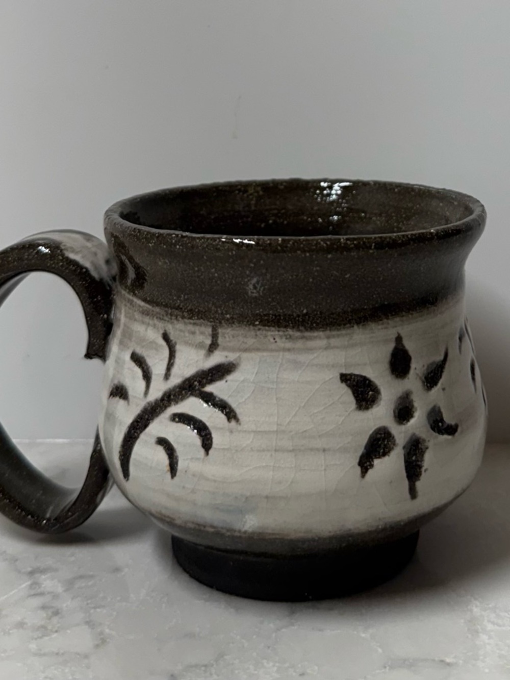 Handcrafted Pottery Mug in Black and Cream - Decorative Floral Design